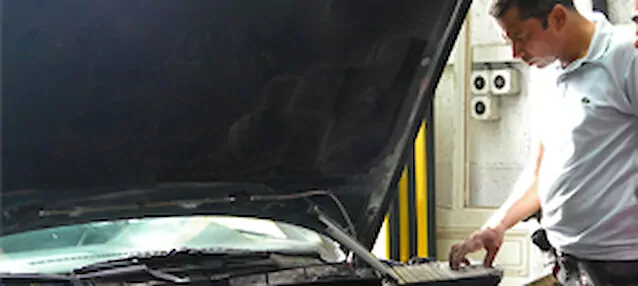 Solidcars technician working on a vehicle